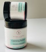 Be Well Company Calming Butter jar with lid and label, showcasing the soothing skincare product on a neutral background.