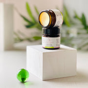 Be Well Company Tea Tree Salve container with product label and natural ingredients visible.